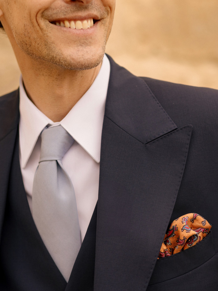 Yellow silk pocket square with paisley patterns