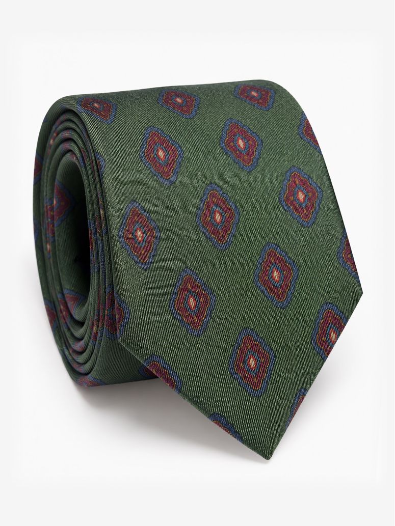 Green silk tie with retro motifs
